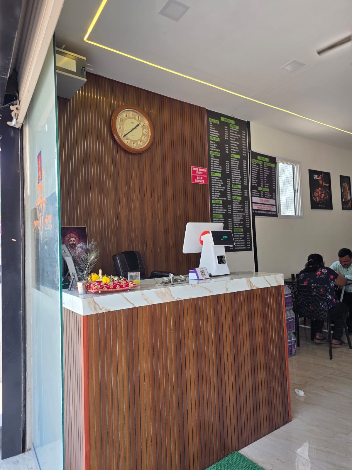 Billing counter with wood panel design — Ram Krishna Hari